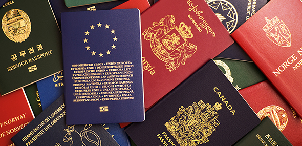pile of passports from various countries